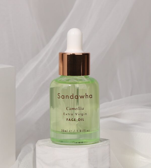 Extra Virgin Face Camellia Oil con telas