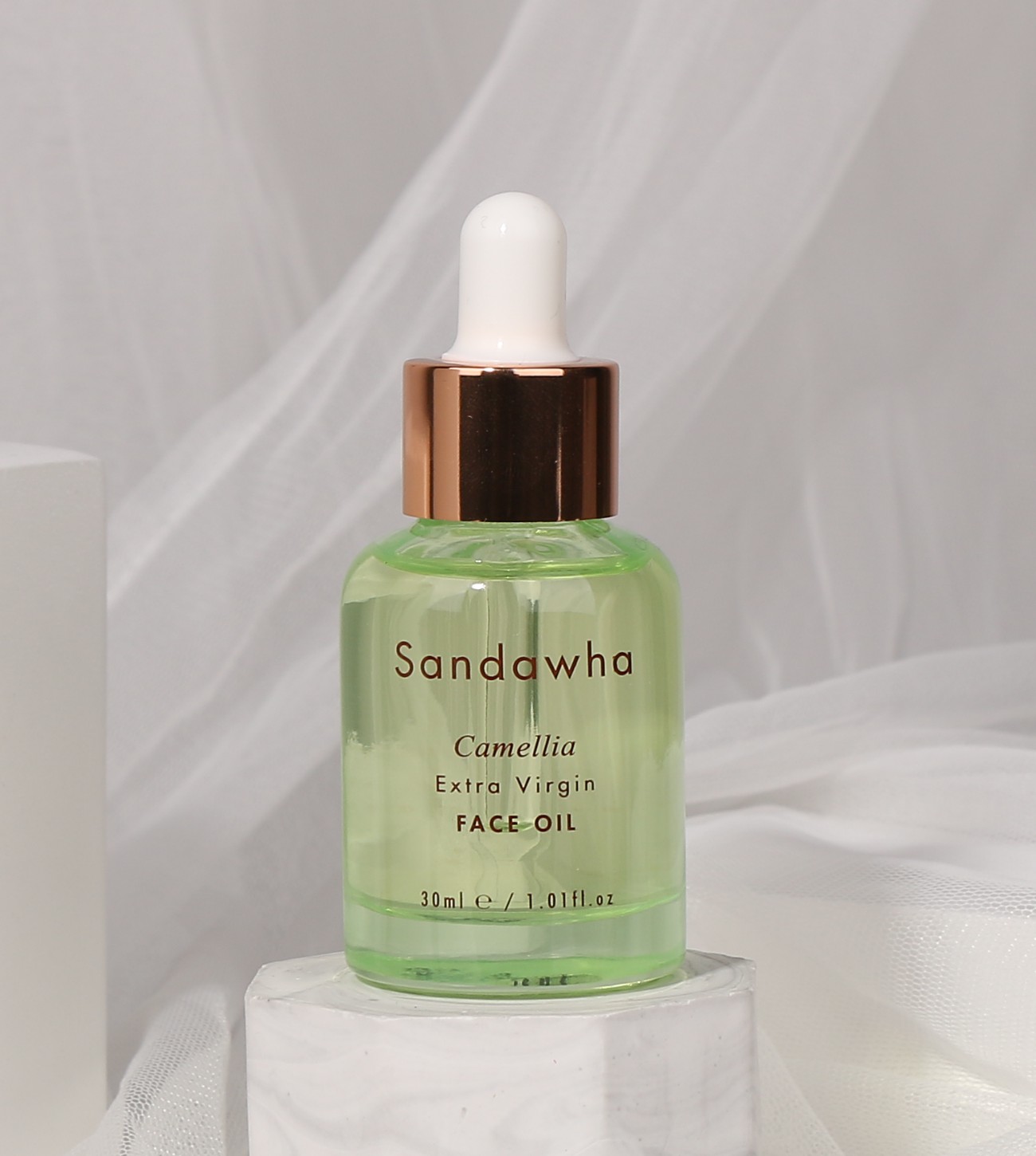 Extra Virgin Face Camellia Oil con telas